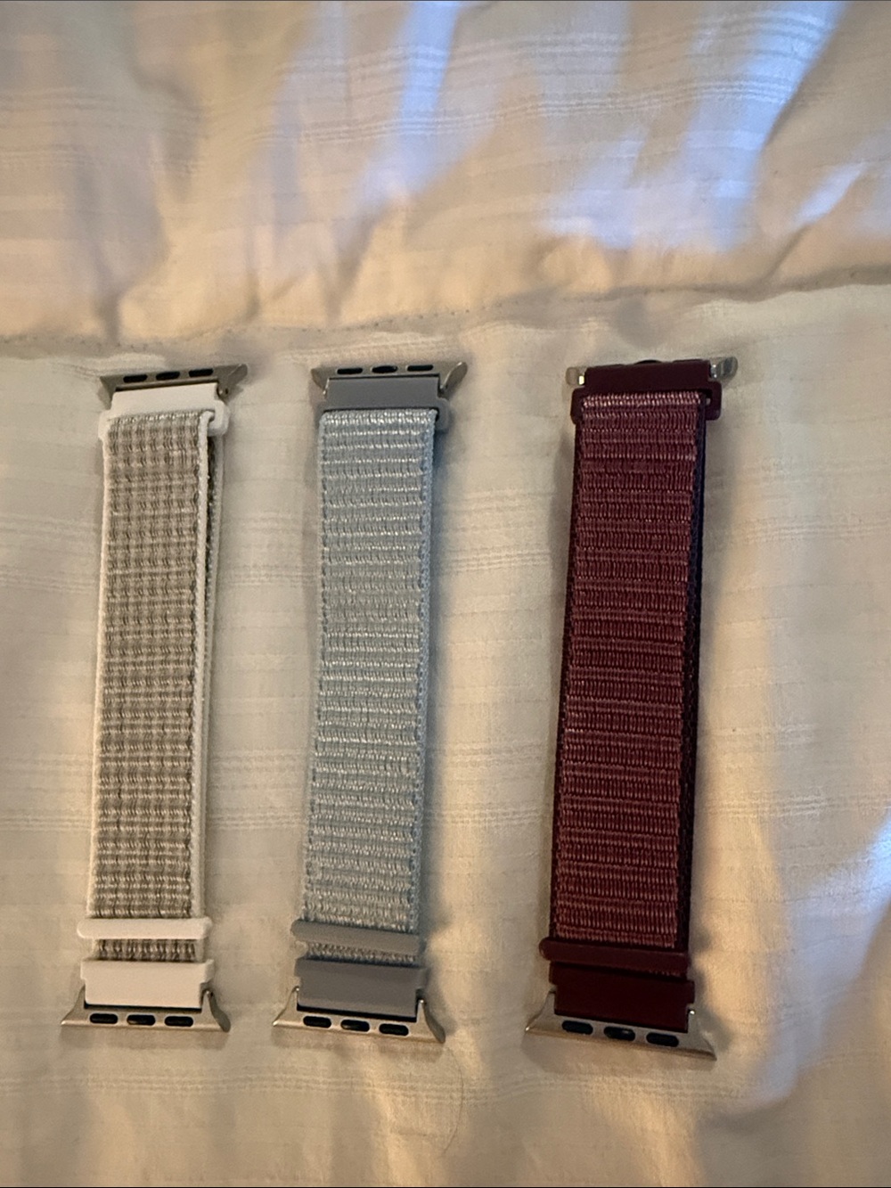 Set of Three Woven Nylon Watch Bands in White, Light Gray, and Burgundy